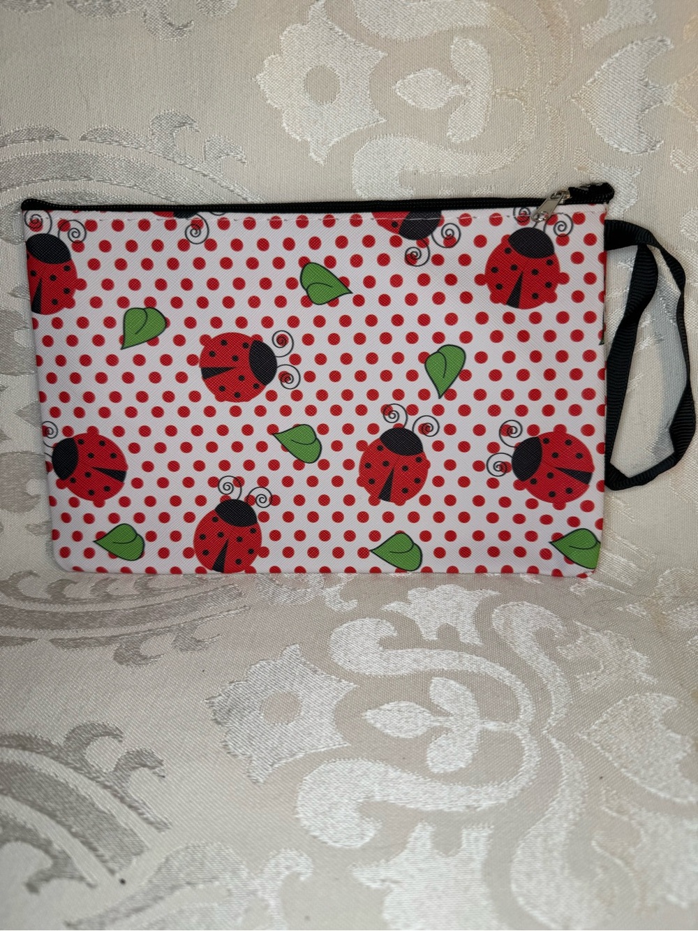 NWOT Ladybug Print Wristlet Pouch - green leaves